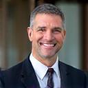Portrait de Jean-Luc Dubois, un homme d'affaires élégant et confiant.